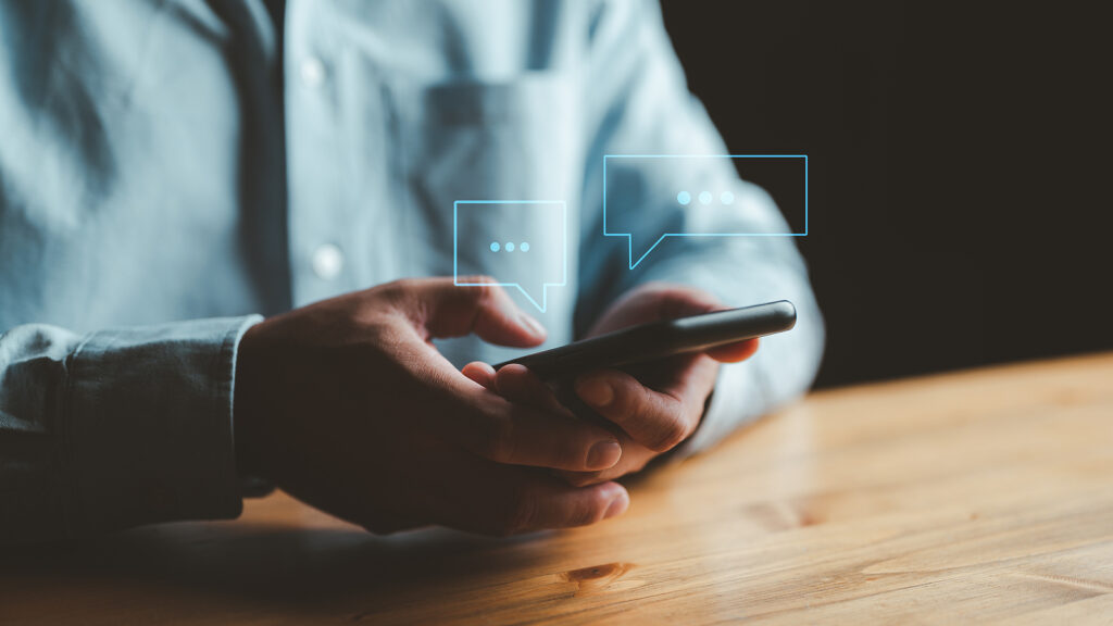 Someone typing on a photo using a live chat