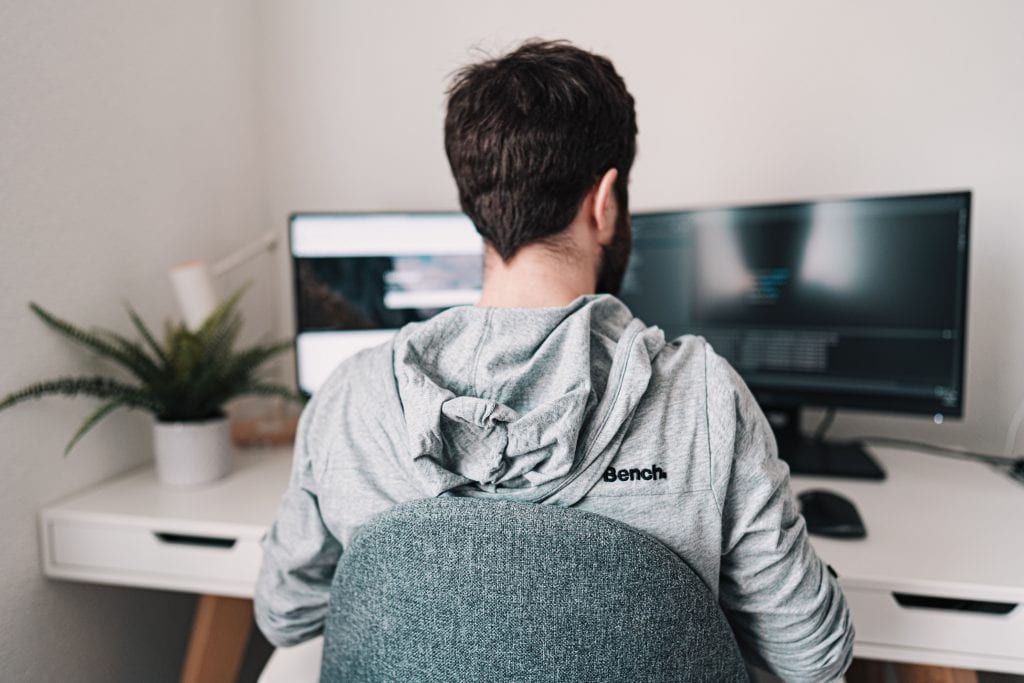 image of a man working at his home office 