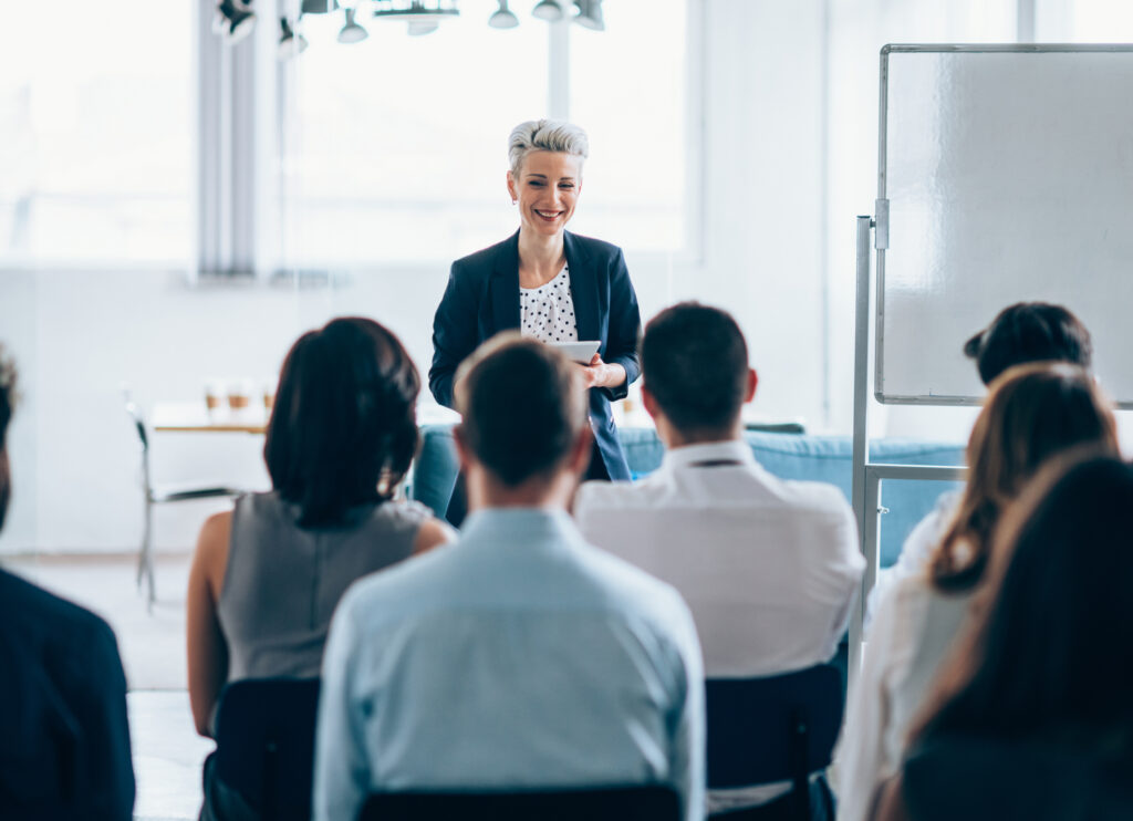 Person talking to an audience at an event