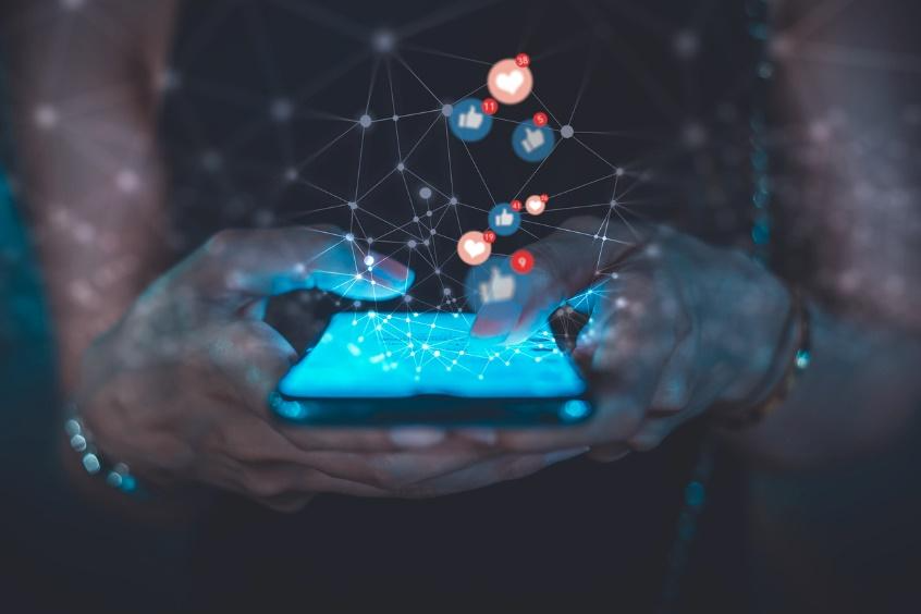 An image of a person on their phone 